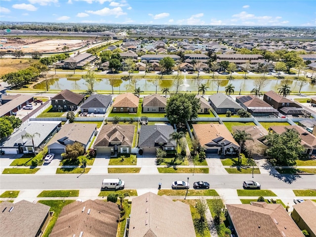 aerial view with a residential view and a water view