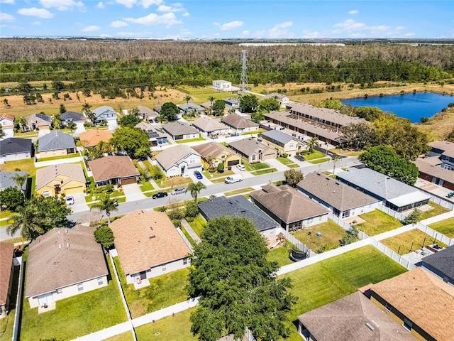 birds eye view of property with a residential view and a water view