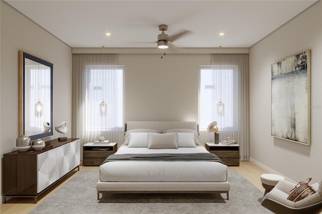 bedroom with ceiling fan and wood finished floors