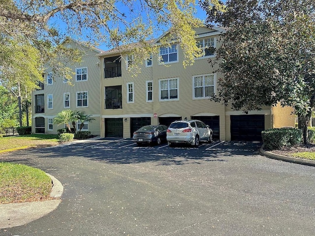 413 Summit Ridge Pl Unit 115, Longwood, FL 32779 - view of property with a garage and driveway