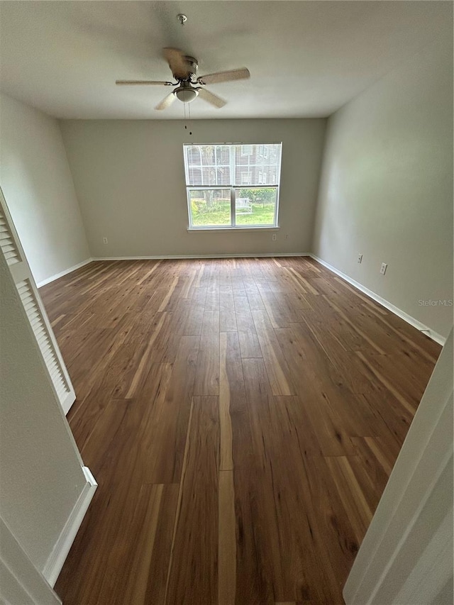 413 Summit Ridge Pl Unit 115, Longwood, FL 32779 - spare room featuring dark wood-type flooring and ceiling fan