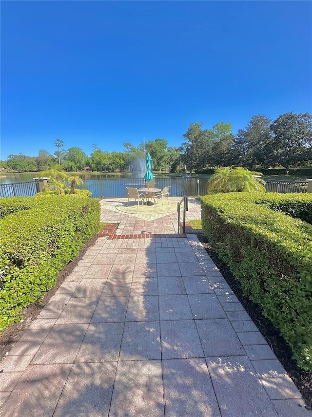 413 Summit Ridge Pl Unit 115, Longwood, FL 32779 - view of patio / terrace featuring a water view