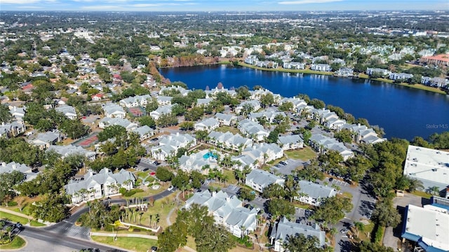 drone / aerial view featuring a residential view and a water view