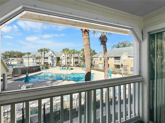 community pool with a residential view