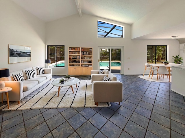 living room with baseboards, beam ceiling, high vaulted ceiling, and dark tile patterned floors