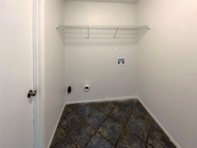 clothes washing area featuring washer hookup, laundry area, baseboards, and gas dryer hookup