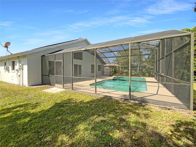 pool with a patio, a lawn, and a lanai