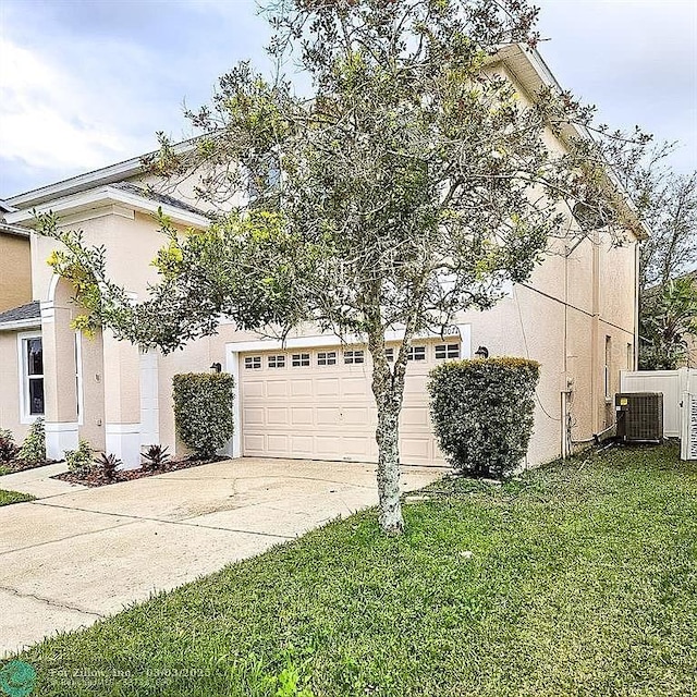 view of property exterior with central AC, a yard, driveway, and stucco siding