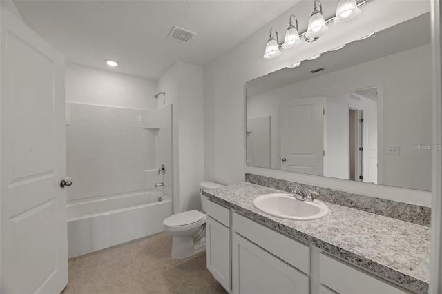 bathroom with tile patterned floors, visible vents, toilet, bathtub / shower combination, and vanity