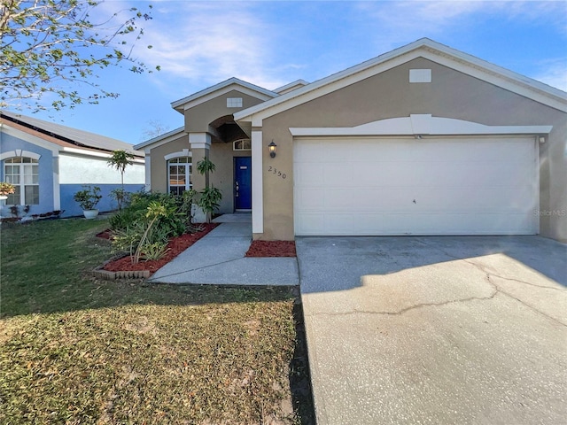 ranch-style house featuring stucco siding, a front yard, concrete driveway, and an attached garage