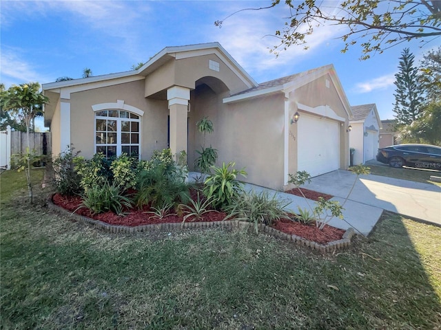 ranch-style house with concrete driveway, an attached garage, fence, and stucco siding