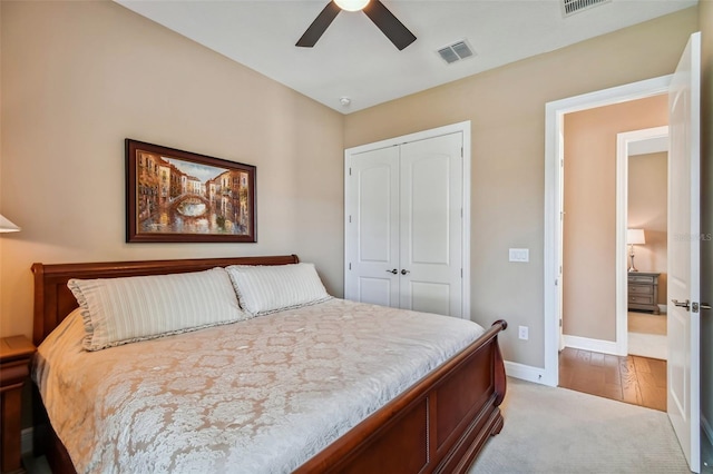 bedroom featuring visible vents, baseboards, a closet, and a ceiling fan