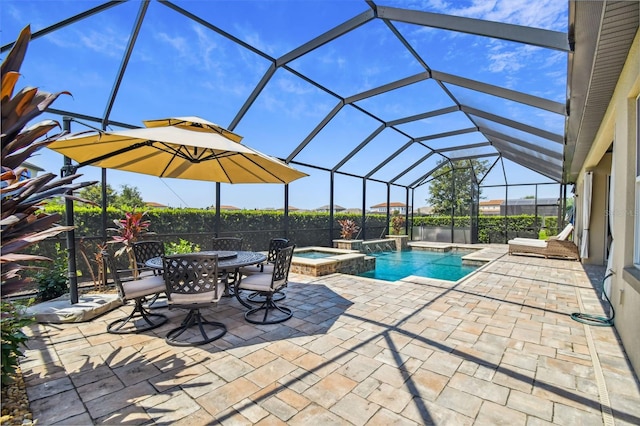 view of pool with a patio, a lanai, and a pool with connected hot tub