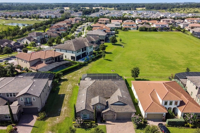 bird's eye view with a residential view and a water view