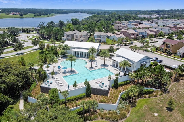 birds eye view of property with a residential view and a water view