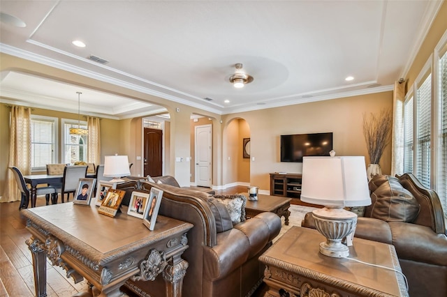 16736 Broadwater Ave, Winter Garden, FL 34787 - living area with arched walkways, hardwood / wood-style floors, healthy amount of natural light, crown molding, and recessed lighting