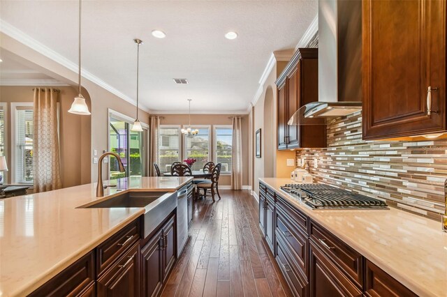 16736 Broadwater Ave, Winter Garden, FL 34787 - kitchen featuring wall chimney exhaust hood, appliances with stainless steel finishes, light countertops, tasteful backsplash, and dark wood-style floors
