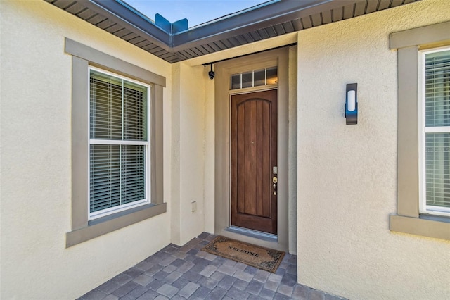 16736 Broadwater Ave, Winter Garden, FL 34787 - property entrance with stucco siding