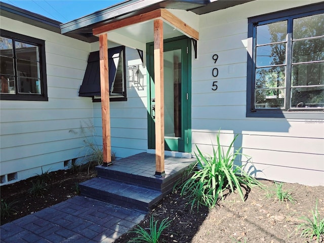 view of exterior entry with crawl space