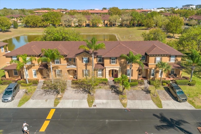 bird's eye view with a residential view and a water view