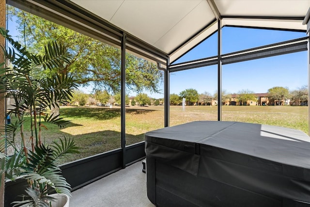 sunroom featuring a hot tub