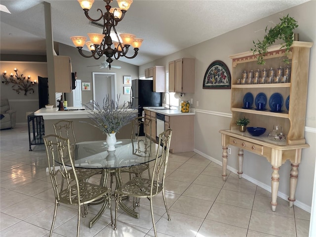 dining space featuring vaulted ceiling, light tile patterned floors, baseboards, and a textured ceiling