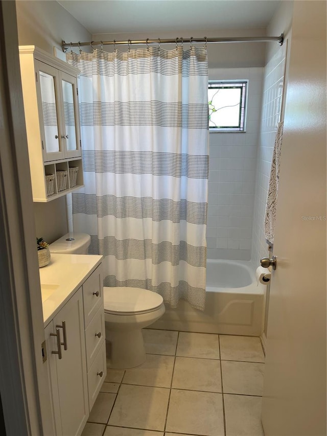 bathroom featuring vanity, tile patterned floors, toilet, and shower / bath combo