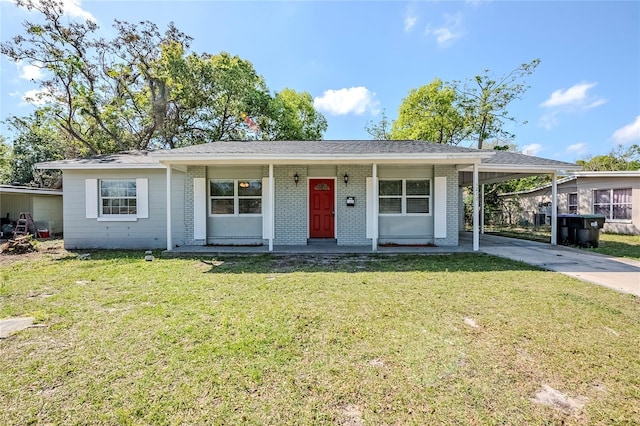 5210 Grandview Dr, Orlando, FL 32808 - view of front of house featuring a front lawn, an attached carport, covered porch, concrete driveway, and brick siding