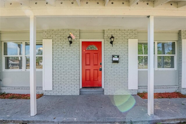 5210 Grandview Dr, Orlando, FL 32808 - entrance to property featuring covered porch and brick siding