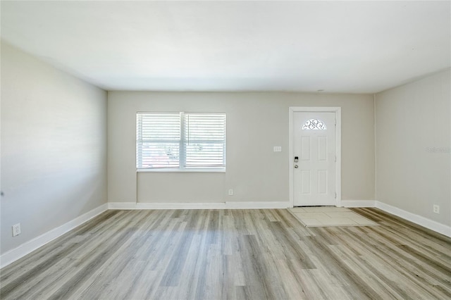 5210 Grandview Dr, Orlando, FL 32808 - foyer featuring light wood-type flooring and baseboards