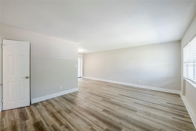 5210 Grandview Dr, Orlando, FL 32808 - empty room with baseboards and light wood-style floors
