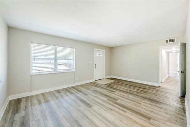 5210 Grandview Dr, Orlando, FL 32808 - interior space with visible vents, baseboards, and wood finished floors