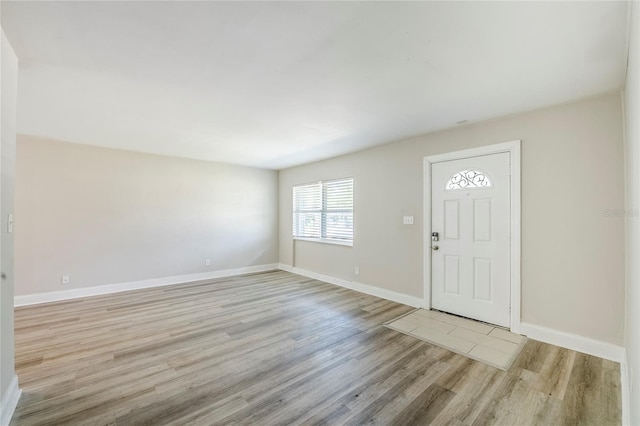5210 Grandview Dr, Orlando, FL 32808 - entryway featuring light wood-style flooring and baseboards