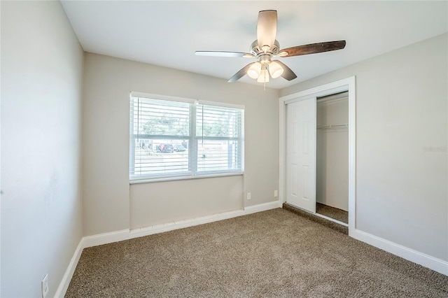 5210 Grandview Dr, Orlando, FL 32808 - unfurnished bedroom featuring a closet, ceiling fan, baseboards, and carpet