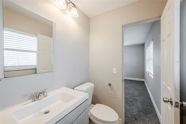 5210 Grandview Dr, Orlando, FL 32808 - bathroom with vanity, toilet, and baseboards