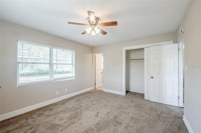 5210 Grandview Dr, Orlando, FL 32808 - unfurnished bedroom featuring a closet, ceiling fan, carpet, and baseboards