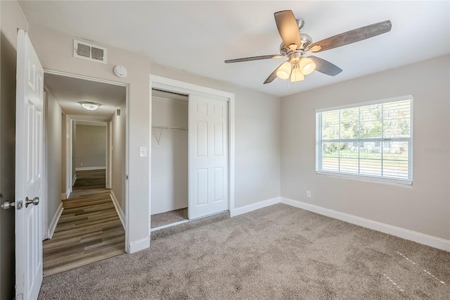 5210 Grandview Dr, Orlando, FL 32808 - unfurnished bedroom featuring a ceiling fan, baseboards, visible vents, carpet floors, and a closet