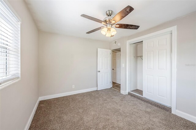 5210 Grandview Dr, Orlando, FL 32808 - unfurnished bedroom with baseboards, visible vents, light carpet, and a closet