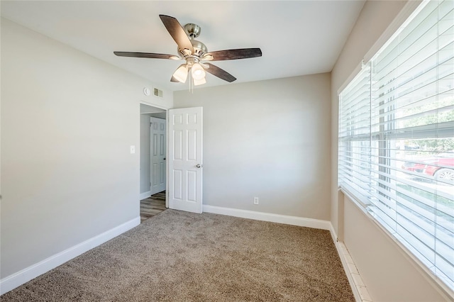 5210 Grandview Dr, Orlando, FL 32808 - carpeted spare room with visible vents, baseboards, and ceiling fan