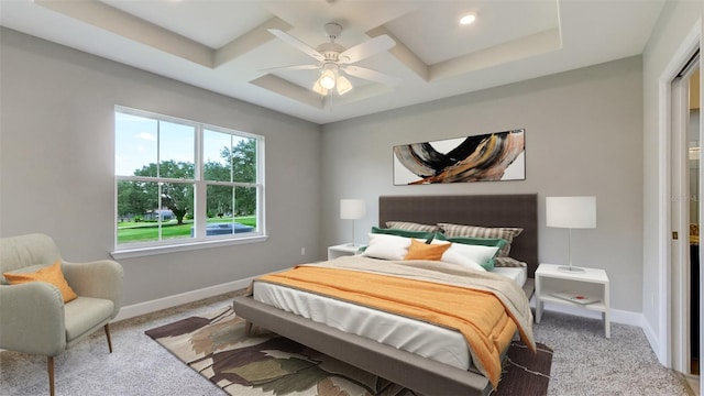 carpeted bedroom with baseboards, coffered ceiling, and a ceiling fan