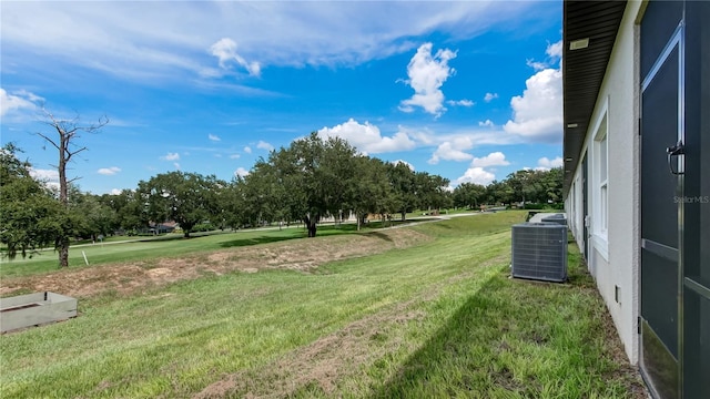 view of yard featuring central AC unit