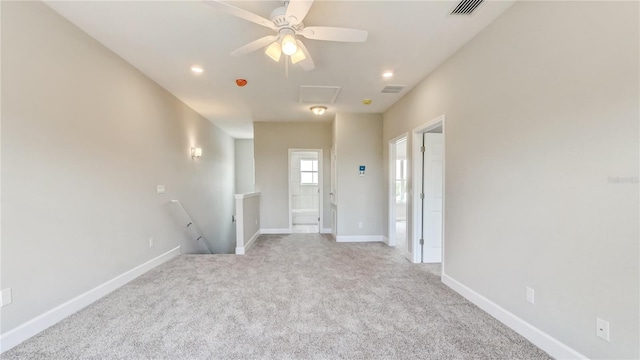 carpeted empty room with recessed lighting, visible vents, baseboards, and ceiling fan