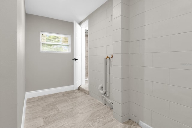 bathroom with baseboards