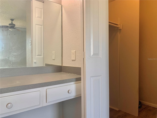 bathroom featuring vanity, wood finished floors, and a ceiling fan