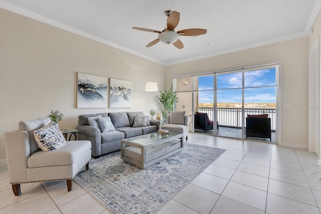 living room with ceiling fan, ornamental molding, and light tile patterned floors