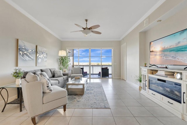 living area with ornamental molding, visible vents, light tile patterned floors, and ceiling fan