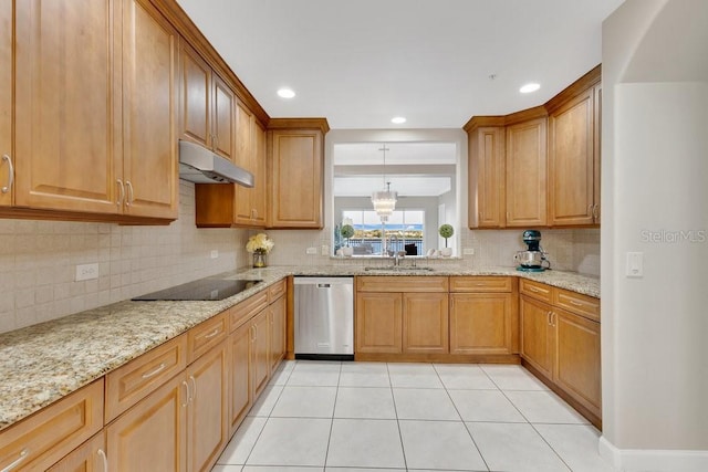 kitchen with under cabinet range hood, a chandelier, stainless steel dishwasher, black electric cooktop, and a sink