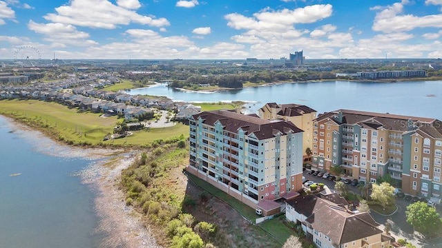 birds eye view of property with a view of city and a water view