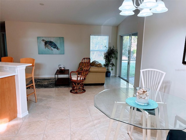 dining room with baseboards, lofted ceiling, a notable chandelier, and light tile patterned flooring