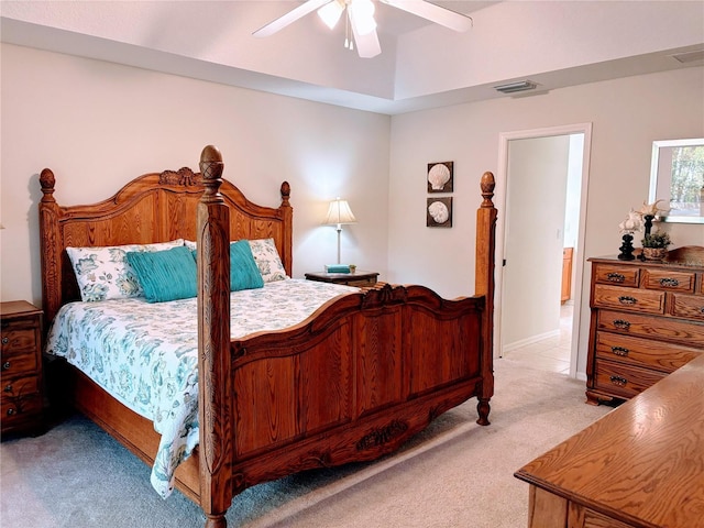 bedroom featuring light carpet, visible vents, and ceiling fan